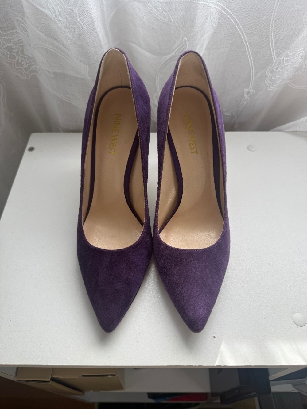 Purple pointed toe pumps